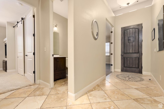 822 E Birken St, Washington, UT 84780 - entrance foyer with a barn door and baseboards