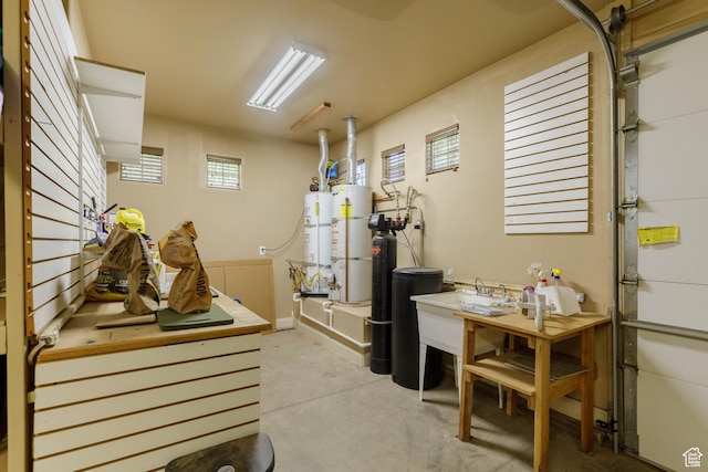 822 E Birken St, Washington, UT 84780 - garage with secured water heater, a sink, and water heater