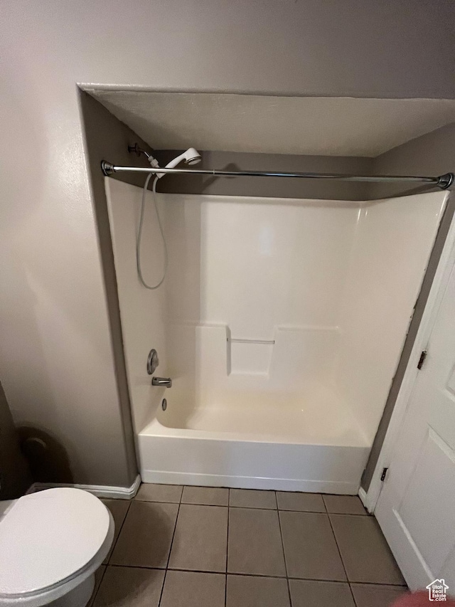3478 E Rdg Route Rd Unit C1, Eagle Mountain, UT 84005 - bathroom with tile patterned flooring,  shower combination, toilet, and baseboards
