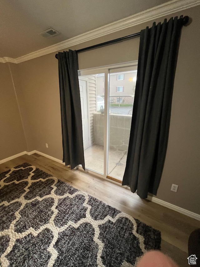 3478 E Rdg Route Rd Unit C1, Eagle Mountain, UT 84005 - empty room with crown molding, wood finished floors, and baseboards