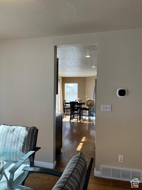 438 E Parowan Way, Draper, UT 84020 - hallway featuring dark wood finished floors, baseboards, and a textured ceiling