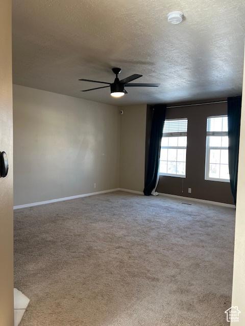 438 E Parowan Way, Draper, UT 84020 - carpeted spare room with a ceiling fan, a textured ceiling, baseboards, and a smoke detector
