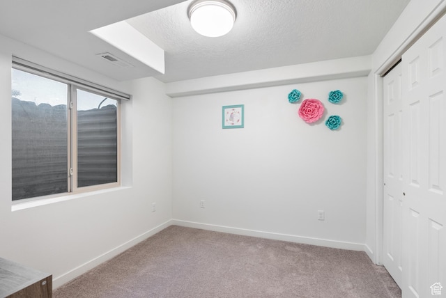 2047 E 1850 S, Spanish Fork, UT 84660 - unfurnished bedroom with carpet flooring, a closet, baseboards, and a textured ceiling