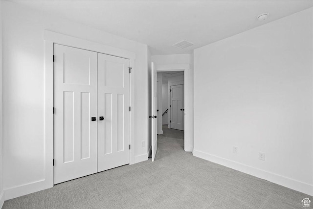 3466 S Peebles Ct E, South Salt Lake, UT 84115 - unfurnished bedroom featuring light carpet, baseboards, and a closet