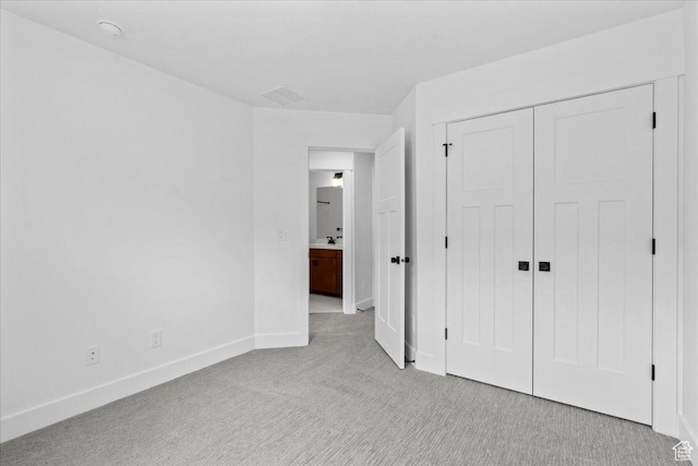 3466 S Peebles Ct E, South Salt Lake, UT 84115 - unfurnished bedroom featuring light carpet, baseboards, and a closet