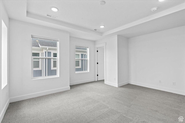 3466 S Peebles Ct E, South Salt Lake, UT 84115 - empty room with a tray ceiling, carpet floors, baseboards, a smoke detector, and recessed lighting