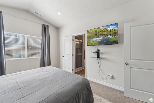 3880 S 1580 W Unit 224, West Valley City, UT 84119 - carpeted bedroom with vaulted ceiling, baseboards, and a textured ceiling