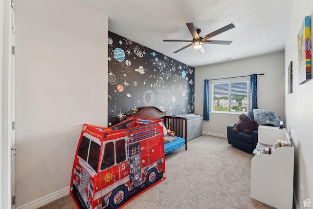 3880 S 1580 W Unit 224, West Valley City, UT 84119 - bedroom featuring carpet flooring, baseboards, a textured ceiling, and ceiling fan