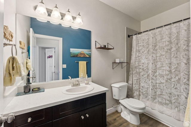 3880 S 1580 W Unit 224, West Valley City, UT 84119 - full bath featuring vanity, toilet, wood finished floors, and shower / tub combo