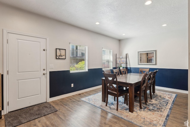 3880 S 1580 W Unit 224, West Valley City, UT 84119 - dining room featuring a textured ceiling, wood finished floors, recessed lighting, and baseboards