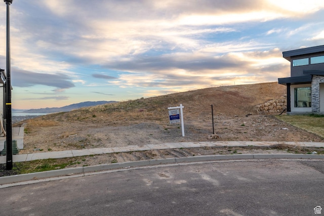 1433 W Summer View Cir Unit 235, Lehi, UT 84043 - yard at dusk featuring a mountain view
