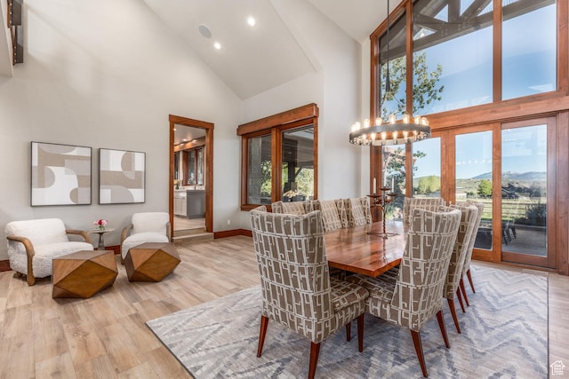 7778 N Greenfield Dr, Park City, UT 84098 - dining space featuring high vaulted ceiling, wood finished floors, a chandelier, recessed lighting, and baseboards