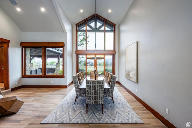 7778 N Greenfield Dr, Park City, UT 84098 - dining area with high vaulted ceiling, light wood-style flooring, baseboards, a chandelier, and recessed lighting