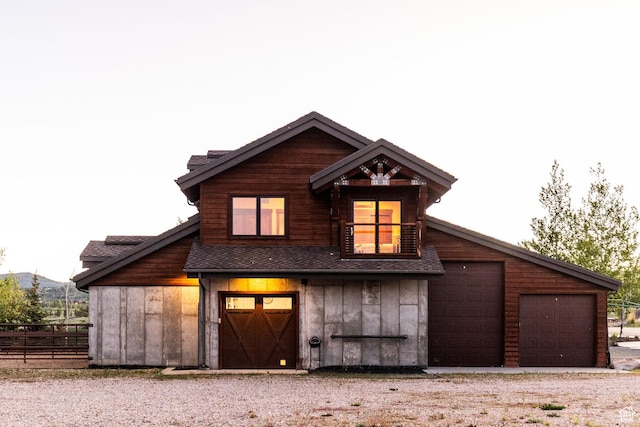7778 N Greenfield Dr, Park City, UT 84098 - view of front of home featuring board and batten siding, roof with shingles, driveway, and a detached garage