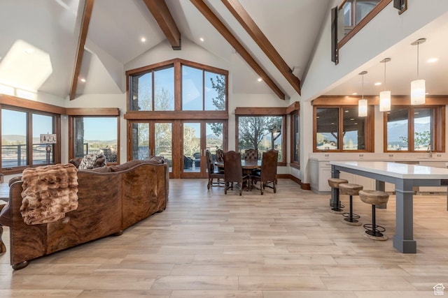 7778 N Greenfield Dr, Park City, UT 84098 - living area featuring beamed ceiling, light wood-style floors, high vaulted ceiling, plenty of natural light, and recessed lighting