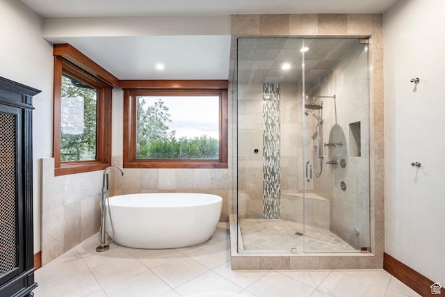 7778 N Greenfield Dr, Park City, UT 84098 - full bath with a freestanding bath, a stall shower, tile patterned flooring, tile walls, and recessed lighting
