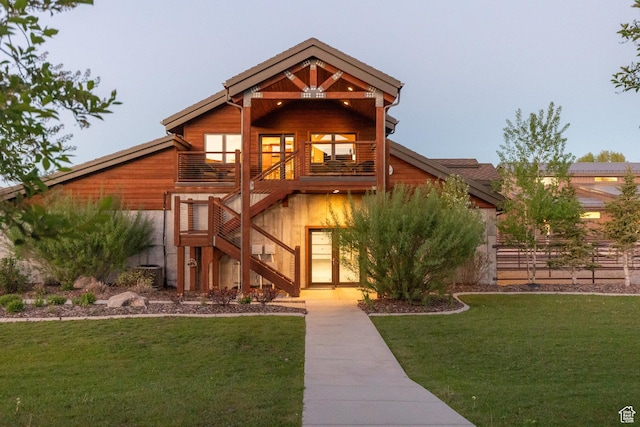 7778 N Greenfield Dr, Park City, UT 84098 - view of front of house featuring stairs, a front lawn, and a balcony