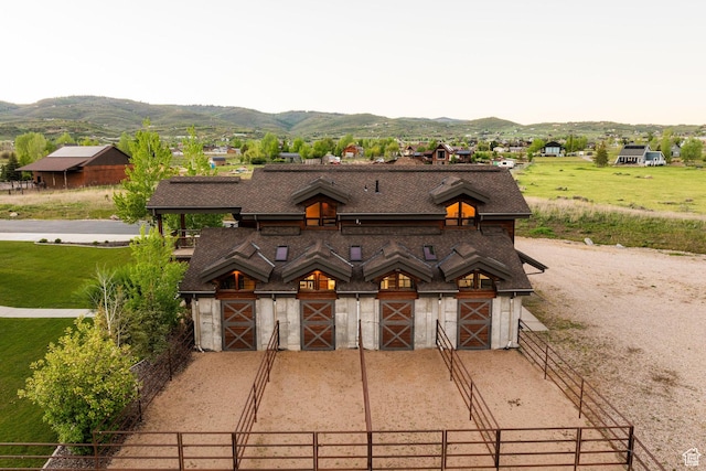 7778 N Greenfield Dr, Park City, UT 84098 - view of front facade featuring a mountain view, an exterior structure, an outbuilding, and a garage