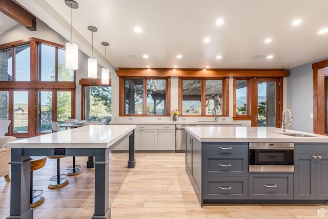 7778 N Greenfield Dr, Park City, UT 84098 - kitchen with a sink, gray cabinets, light countertops, recessed lighting, and light wood finished floors