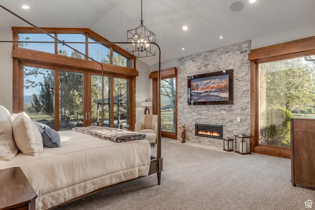7778 N Greenfield Dr, Park City, UT 84098 - carpeted bedroom with a chandelier, a fireplace, multiple windows, vaulted ceiling, and recessed lighting