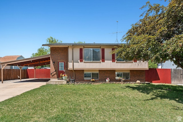 609 N Porter Ave, Ogden, UT 84404 - view of front of property featuring a carport, brick siding, and concrete driveway