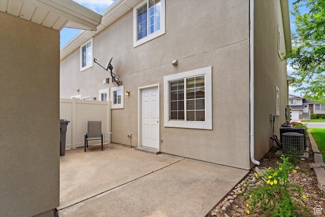 1338 E 6125 S, South Ogden, UT 84405 - back of house featuring a patio, central air condition unit, and stucco siding