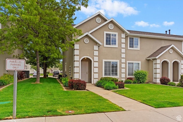 1338 E 6125 S, South Ogden, UT 84405 - view of property featuring stucco siding and a front yard