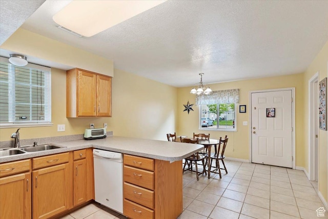 1338 E 6125 S, South Ogden, UT 84405 - kitchen featuring white dishwasher, a peninsula, a sink, a chandelier, and light tile patterned floors