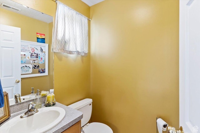 1338 E 6125 S, South Ogden, UT 84405 - bathroom featuring toilet and vanity