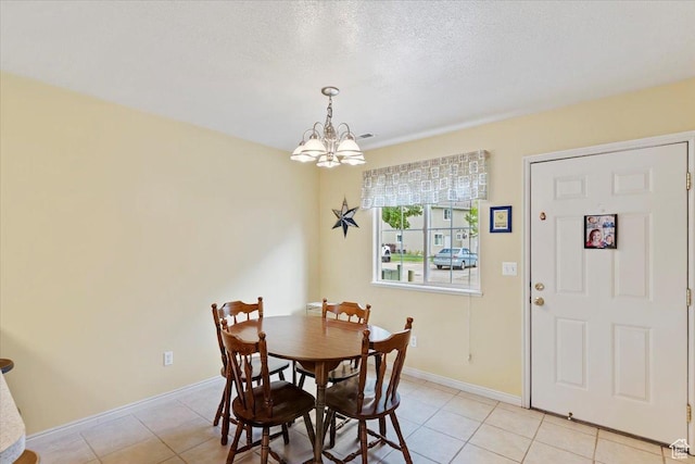 1338 E 6125 S, South Ogden, UT 84405 - dining room with a chandelier, light tile patterned floors, baseboards, and a textured ceiling