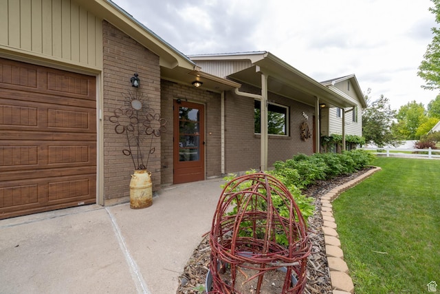 2155 W 900 N, Maeser, UT 84078 - entrance to property featuring brick siding, a yard, and a garage