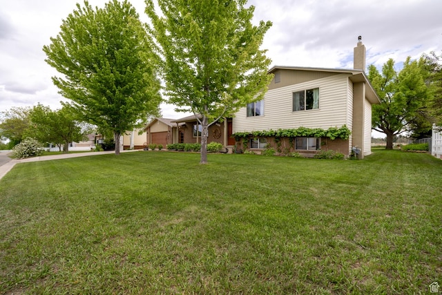 2155 W 900 N, Maeser, UT 84078 - split level home featuring a chimney and a front yard