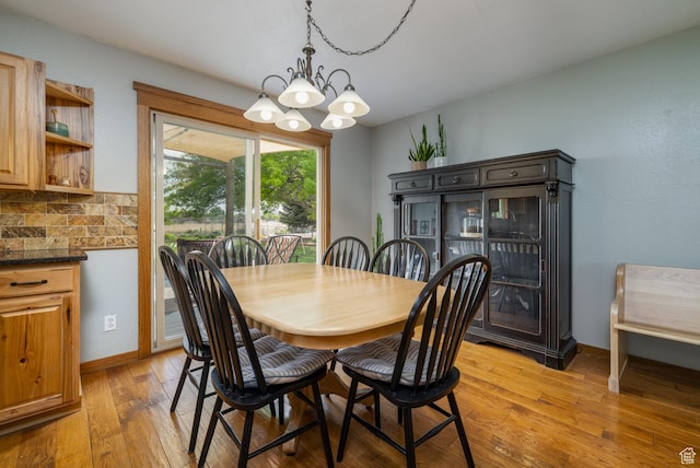 2155 W 900 N, Maeser, UT 84078 - dining space with a chandelier, light wood-type flooring, and baseboards