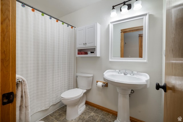 2155 W 900 N, Maeser, UT 84078 - full bathroom with toilet, baseboards, and curtained shower