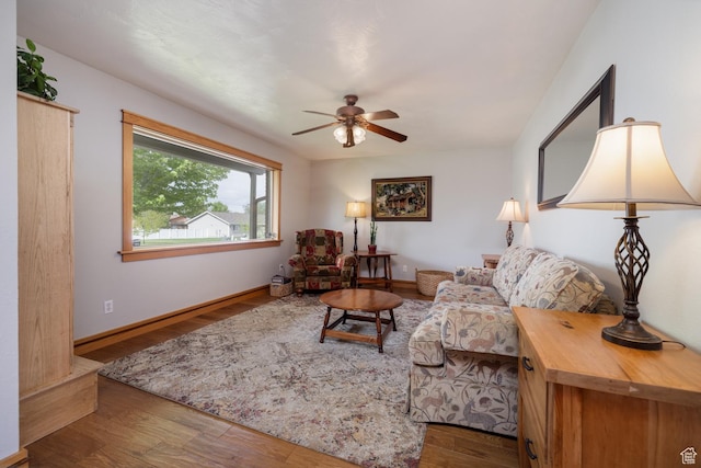 2155 W 900 N, Maeser, UT 84078 - living area featuring wood finished floors, ceiling fan, and baseboards