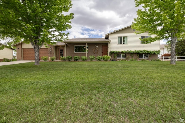 2155 W 900 N, Maeser, UT 84078 - tri-level home featuring an attached garage, concrete driveway, and brick siding