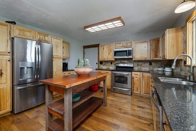 2155 W 900 N, Maeser, UT 84078 - kitchen with stainless steel appliances, a sink, decorative backsplash, dark wood-type flooring, and dark stone counters