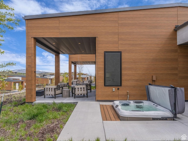 6417 Double Deer Loop, Park City, UT 84098 - view of patio featuring a covered hot tub and an outdoor hangout area