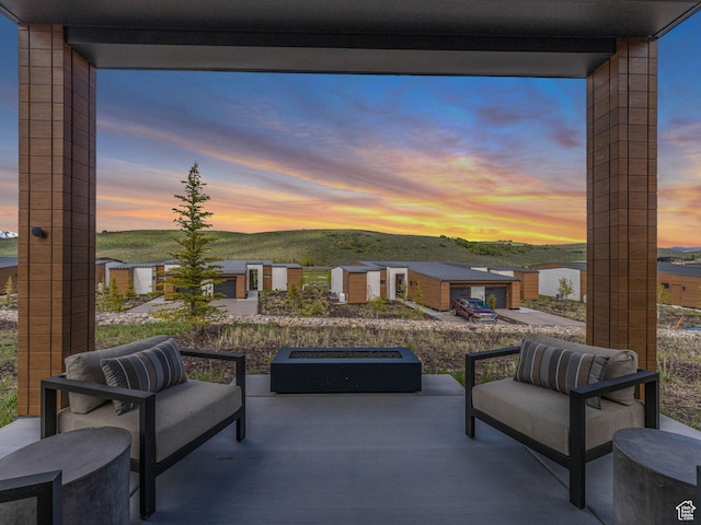 6417 Double Deer Loop, Park City, UT 84098 - patio terrace at dusk with a patio, a mountain view, and an outdoor fire pit