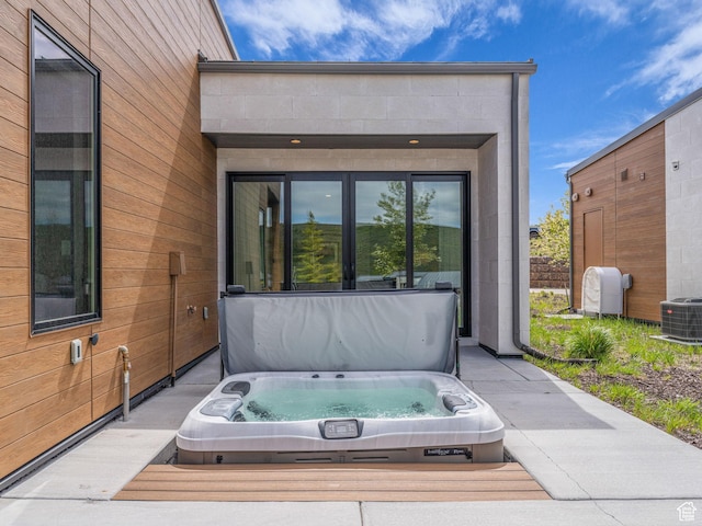 6417 Double Deer Loop, Park City, UT 84098 - view of patio / terrace with a covered hot tub and central air condition unit