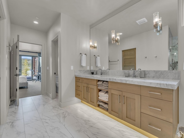 6417 Double Deer Loop, Park City, UT 84098 - bathroom with vanity, toilet, connected bathroom, baseboards, and a chandelier