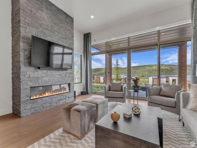 6417 Double Deer Loop, Park City, UT 84098 - living room featuring a fireplace, light wood finished floors, recessed lighting, and healthy amount of natural light
