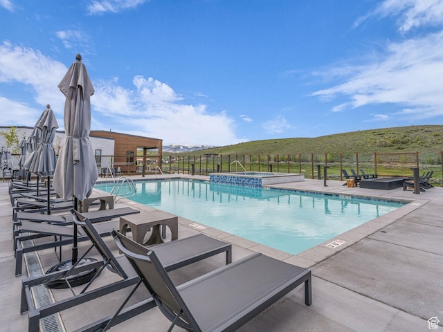 6417 Double Deer Loop, Park City, UT 84098 - view of swimming pool featuring a pool with connected hot tub and a patio area