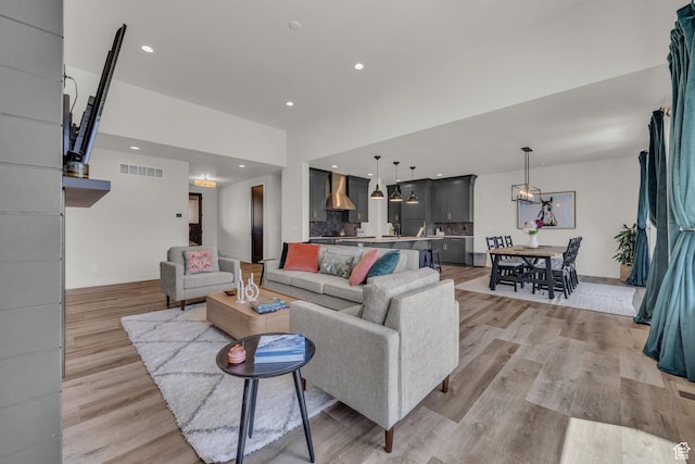 336 Big Meadow Dr, Kamas, UT 84036 - living room featuring light wood-type flooring, a chandelier, baseboards, and recessed lighting