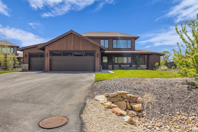 336 Big Meadow Dr, Kamas, UT 84036 - view of front of home with stone siding, driveway, a garage, and a front lawn