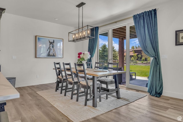 336 Big Meadow Dr, Kamas, UT 84036 - dining room with baseboards, wood finished floors, and a chandelier