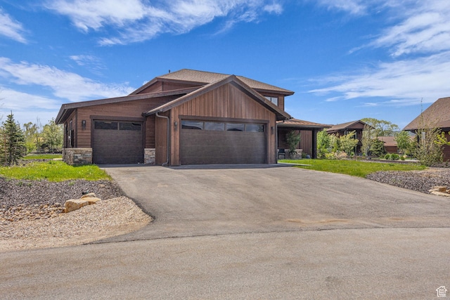336 Big Meadow Dr, Kamas, UT 84036 - view of front facade featuring driveway, an attached garage, and stone siding