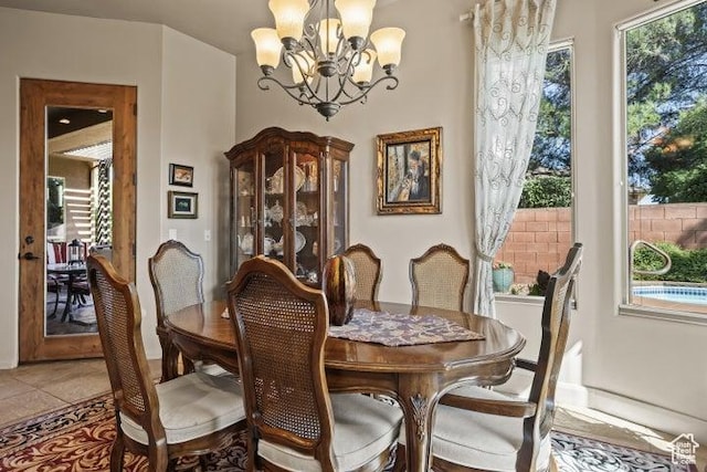 1618 N 775 W, Washington, UT 84780 - dining room featuring a chandelier, light tile patterned floors, and baseboards