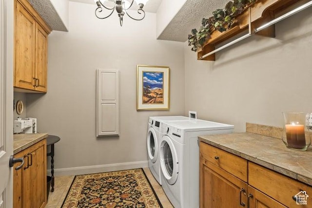 1618 N 775 W, Washington, UT 84780 - laundry area featuring washer and clothes dryer, cabinet space, baseboards, a chandelier, and light tile patterned floors