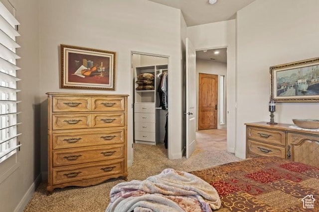 1618 N 775 W, Washington, UT 84780 - bedroom featuring light carpet, a walk in closet, a closet, and baseboards